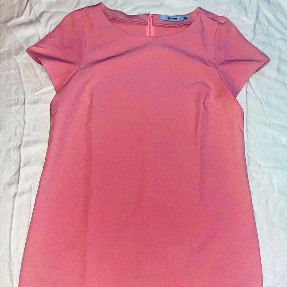 Pink dress with scalloped edge